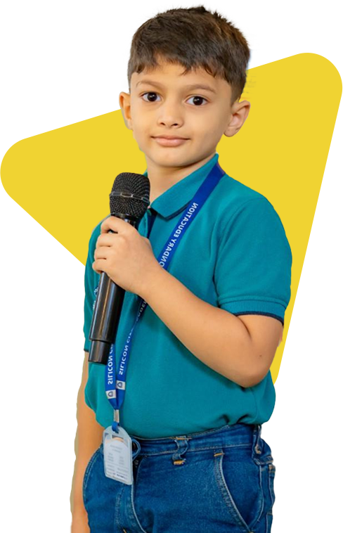 Student of Silicon City International School with microphone